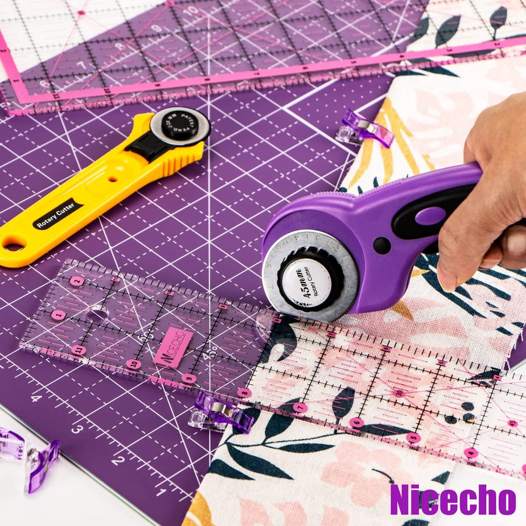 Rotary cutter set with fabric, rulers, and cutting mat. Hand holding purple cutter.