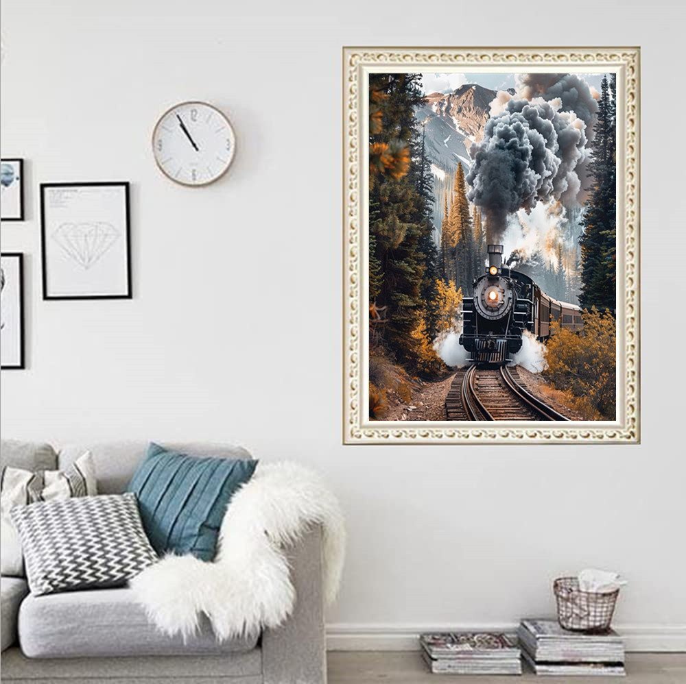 Diamond painting of a steam train traveling through a forest with mountains in the background.