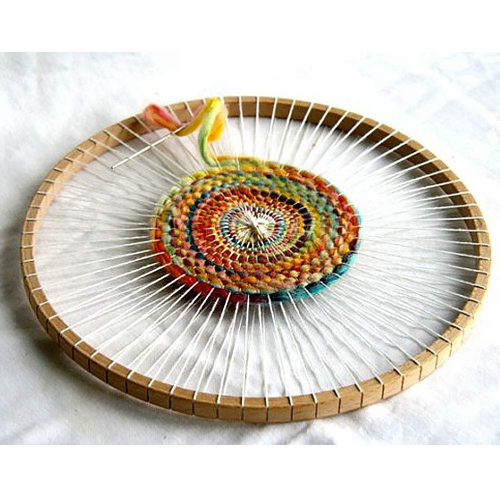 Round wooden knitting loom with colorful woven craft in progress, white warp threads visible