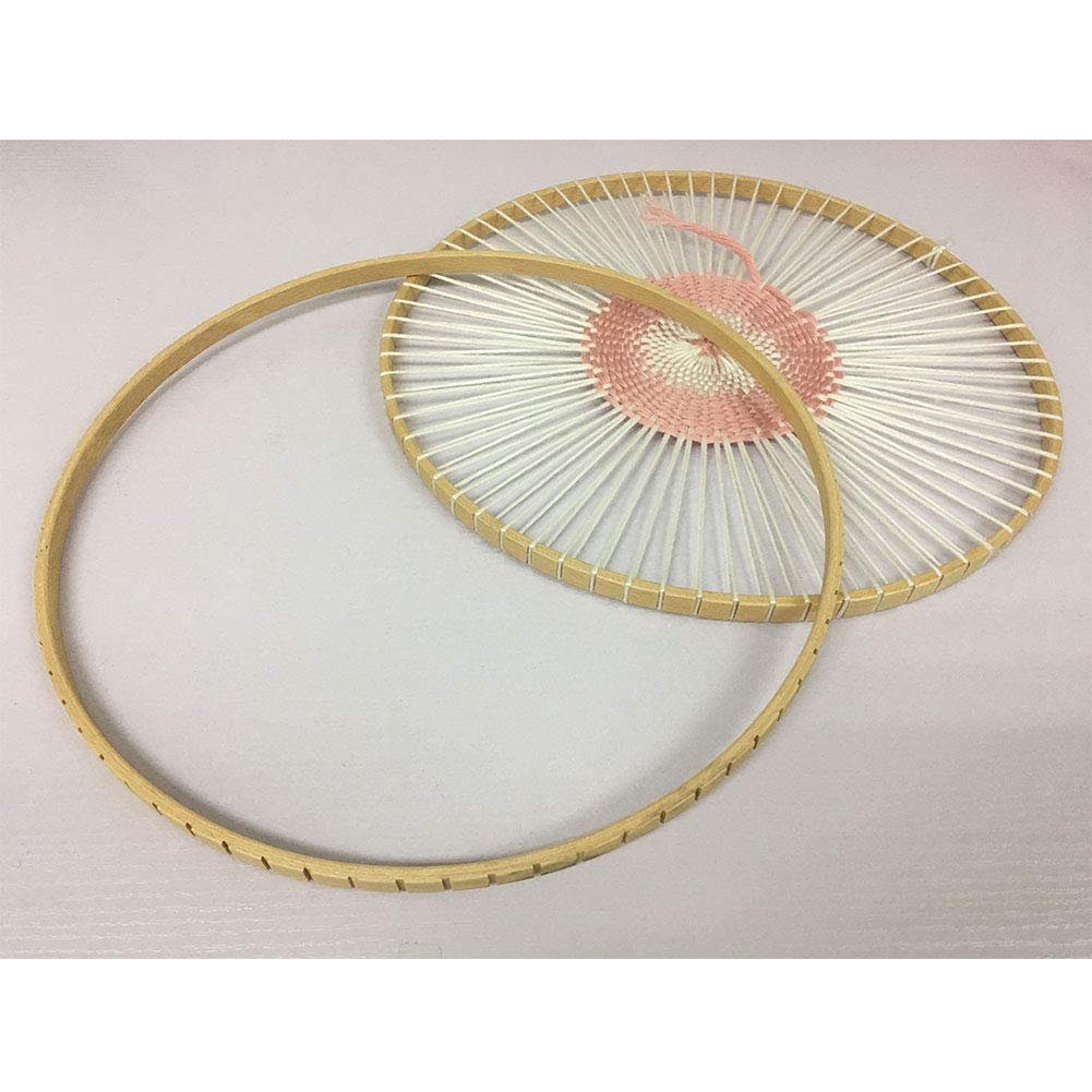 Round wooden knitting loom with white and pink yarn woven in a circular pattern, one hoop is separate.