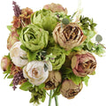 Close-up of a rustic bouquet of artificial peonies and hydrangeas in green, beige, and cream colors, with purple accents.