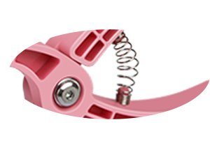 Close-up of a pink crochet safety eye tool with a visible spring mechanism and metal rivet.