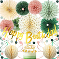 Birthday party decorations including paper fans, pom poms, honeycomb balls, and a gold 'Happy Birthday' banner.