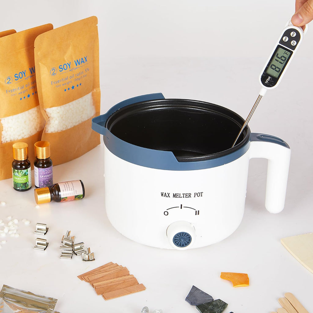Scented candle making kit contents including soy wax bags, fragrance oils, wax melter pot, and thermometer.
