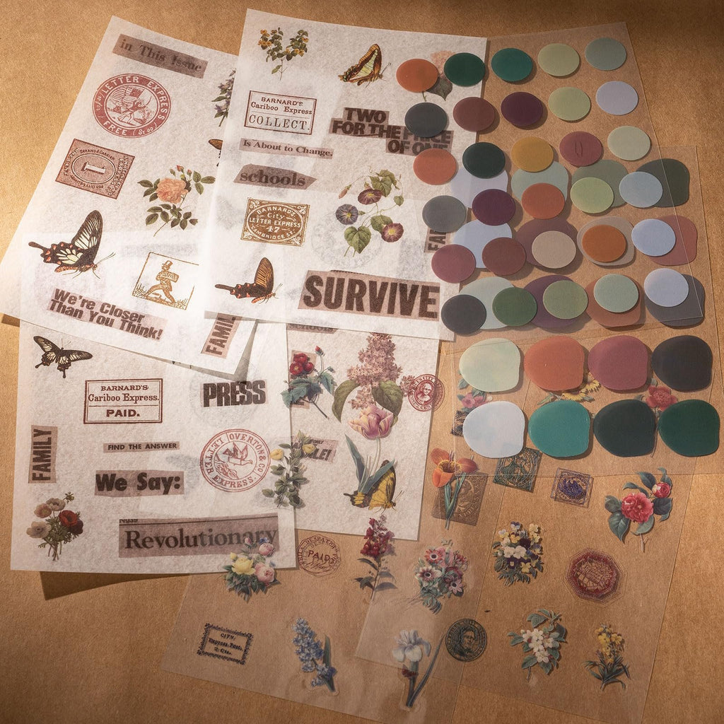 Assortment of vintage-style stickers and circular adhesive dots for journaling and crafts.