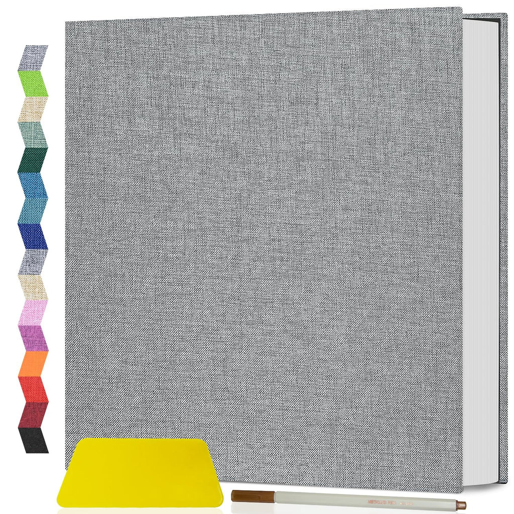 Gray linen cover scrapbook album with color swatches on the left and a yellow squeegee and pen at the bottom.