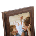 Rustic brown wood picture frame showing a mother and child looking at each other