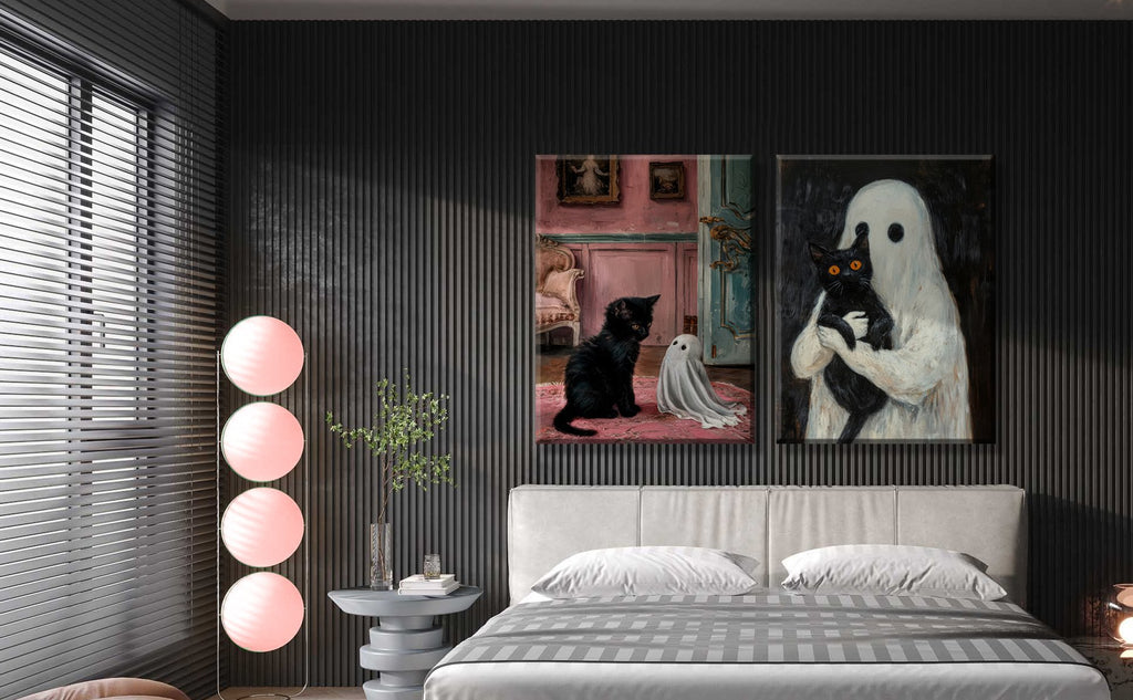 Two framed gothic Halloween canvas prints of a black cat with a ghost displayed above a bed in a modern bedroom.