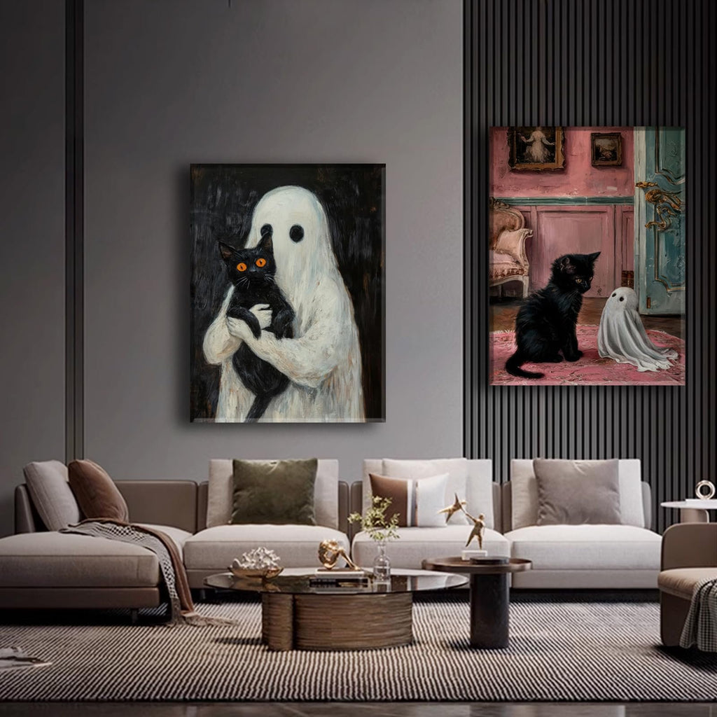 Two framed gothic Halloween canvas art prints of ghosts and black cats displayed in a modern living room setting.