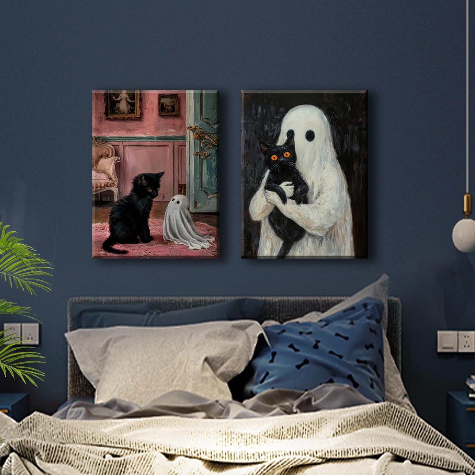 Two framed gothic Halloween canvas art prints depicting black cats and ghosts hanging above a bed.