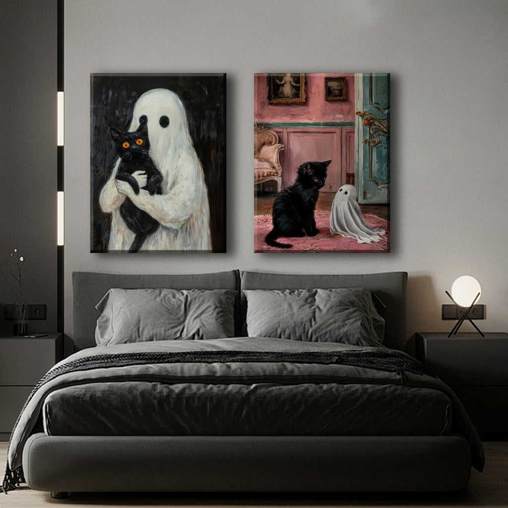 Two framed gothic Halloween canvas art prints depicting a ghost holding a black cat and a black cat with a ghost on a rug.