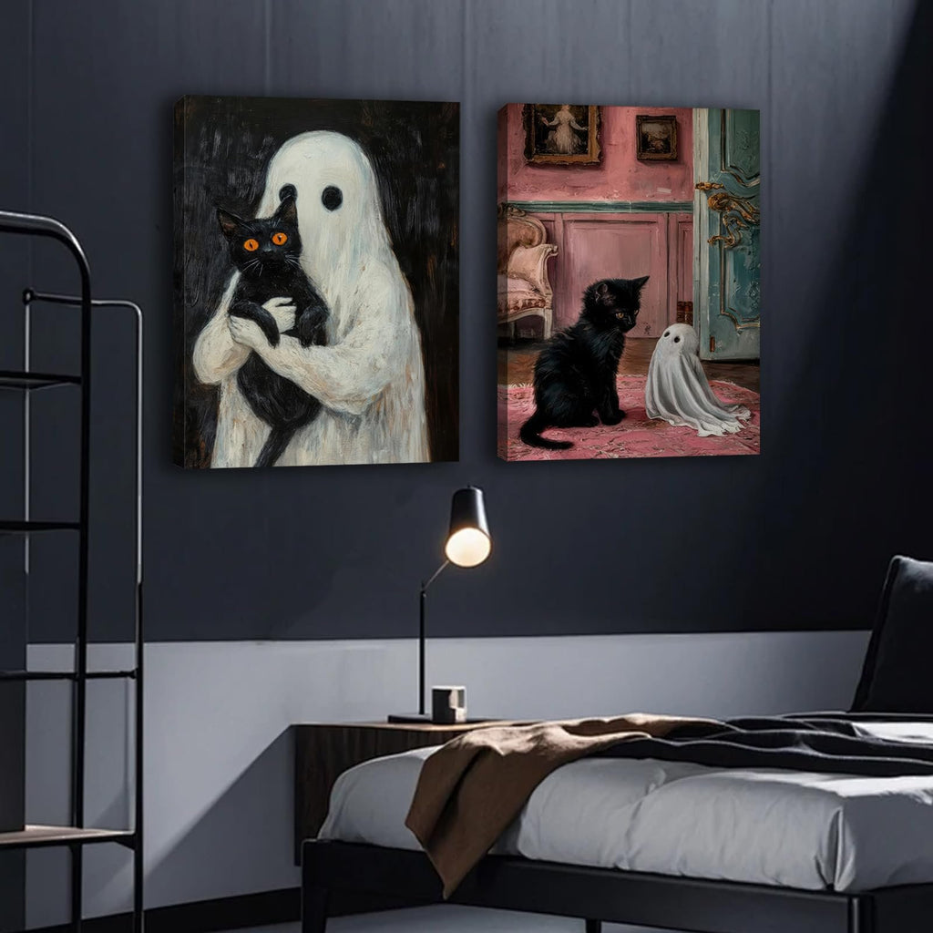 Two framed gothic Halloween canvas art prints depicting a ghost holding a black cat and a black cat with a small ghost on a pink rug.
