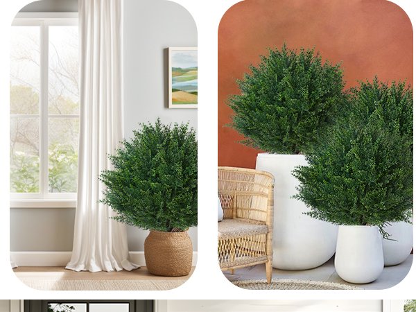 Two artificial cypress topiary trees in white planters on a patio, one next to a wicker chair.