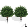 Two artificial cypress topiary trees with ground spikes on a white background, with separate ground spike accessories shown.
