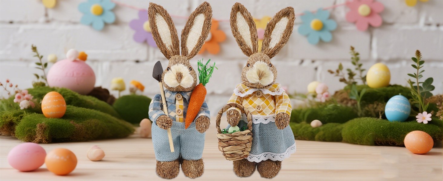 Two straw and sisal Easter bunny figurines, one holding a carrot and shovel, the other a basket of eggs, surrounded by moss and Easter eggs.