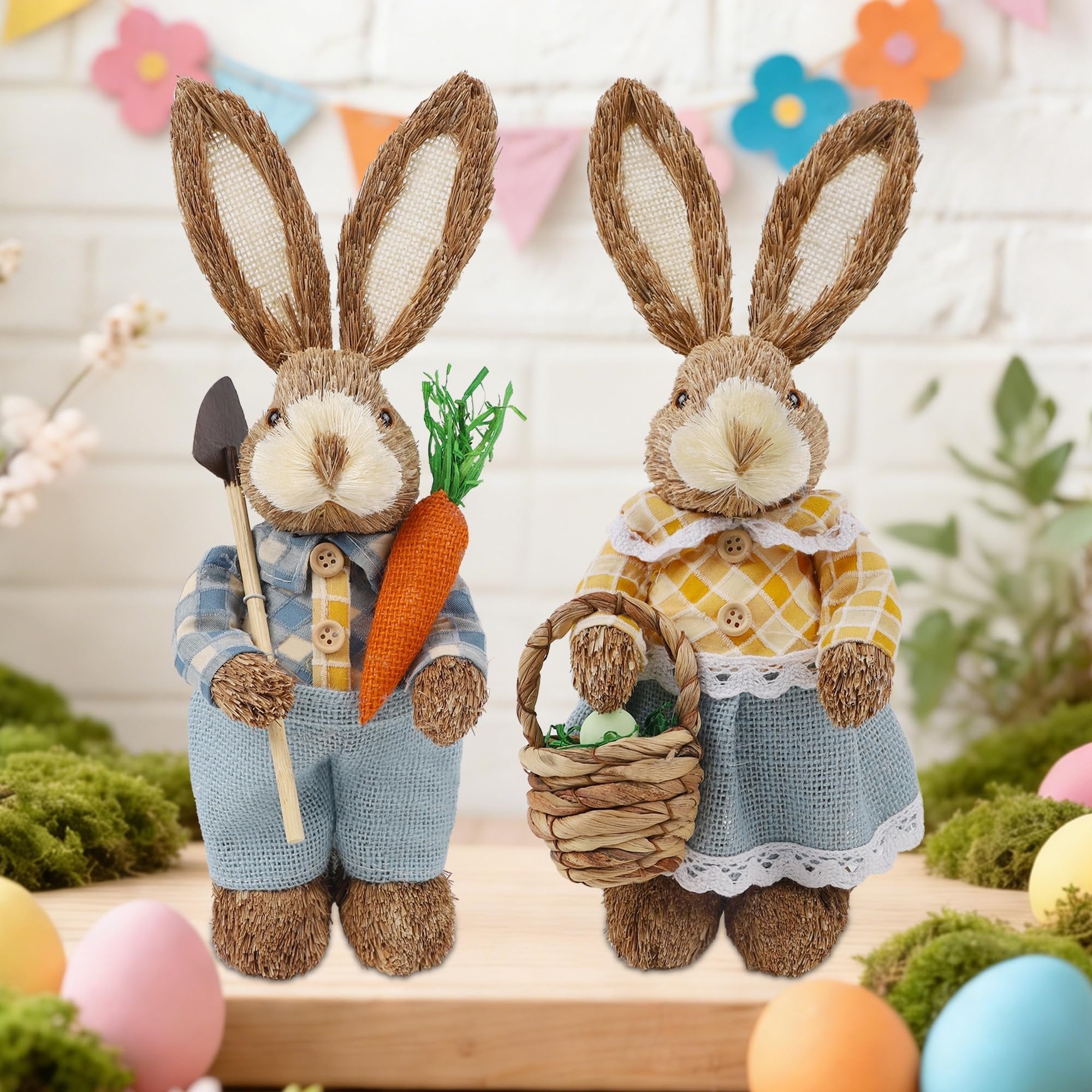 Two straw Easter bunny figurines, one holding a carrot and shovel, the other a basket, with Easter eggs and a banner in the background.