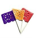 Three mini papel picado tissue paper flag picks in purple, orange, and red on white background.