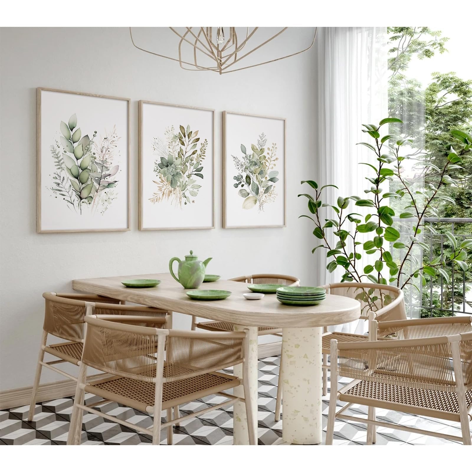 Set of three unframed watercolor botanical canvas wall art prints hanging above a dining table with chairs.