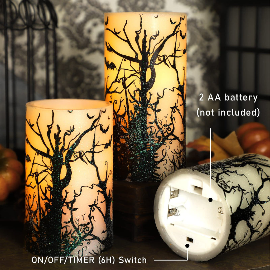 Three flameless LED pillar candles with black tree and bat decals, one showing battery compartment.