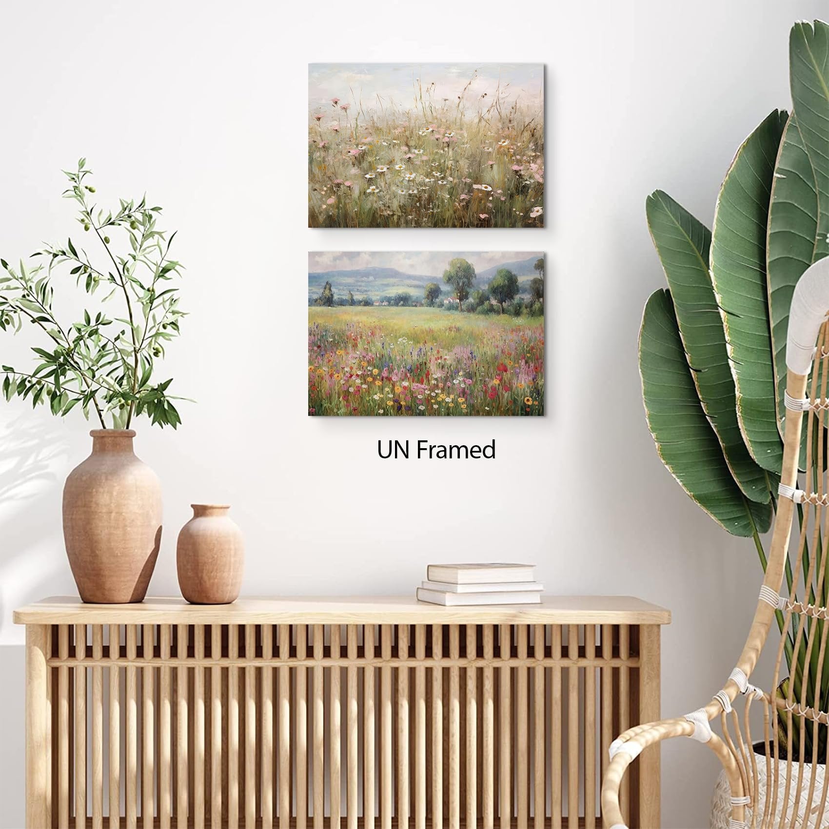 Two unframed wildflower landscape art prints displayed on a wall above a wooden cabinet.