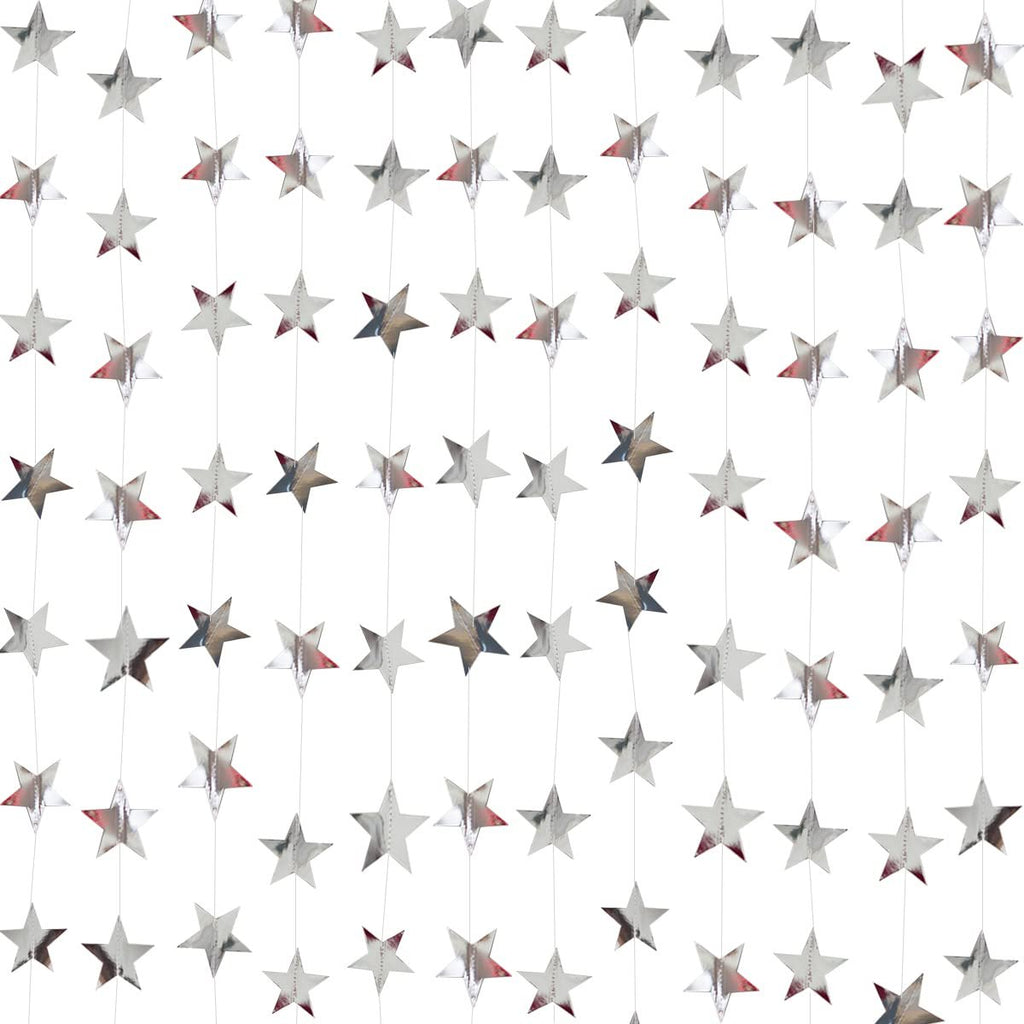 Silver glitter star paper garland decorations hanging in rows against a white background.