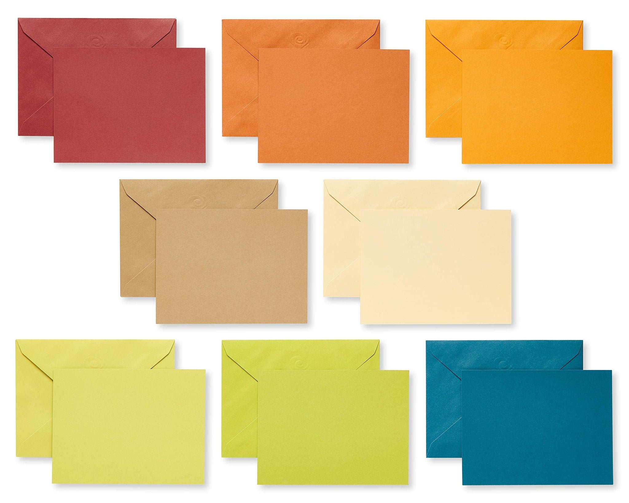 Set of blank note cards and envelopes in various earthtone colors arranged in rows on a white background.