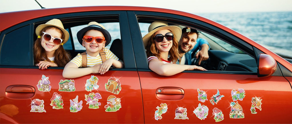 Family in a car by the ocean, with diamond painting magnets on the car door