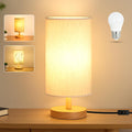 Small bedside lamp with fabric shade and wood base, shown with inset images of different shade patterns and an LED bulb.