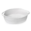 Oval woven cotton rope basket with handles, shown from a side angle on a white background.