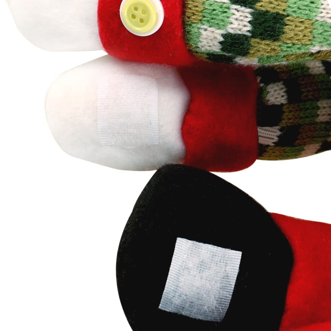 Close-up of a plush snowman Christmas tree topper's hands and feet with velcro patches.
