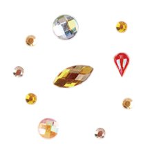 Assortment of colorful faceted rhinestones and crystals arranged in a circle on a white background.