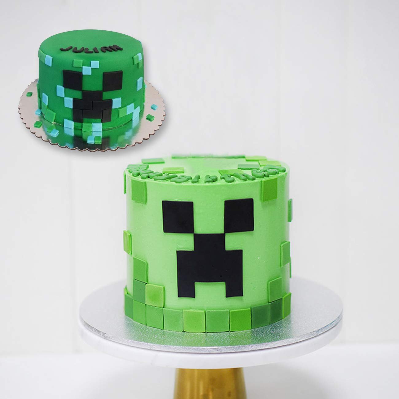 Two green cakes decorated with pixelated black faces, one with 'JULIAN' text on top.
