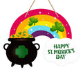 St. Patrick's Day door sign with a rainbow, pot of gold, and shamrocks, reading 'Happy St. Patrick's Day'.