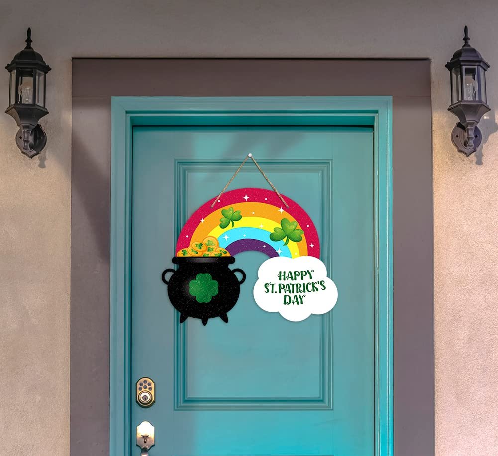St. Patrick's Day rainbow door sign with a pot of gold and shamrocks hanging on a teal door.