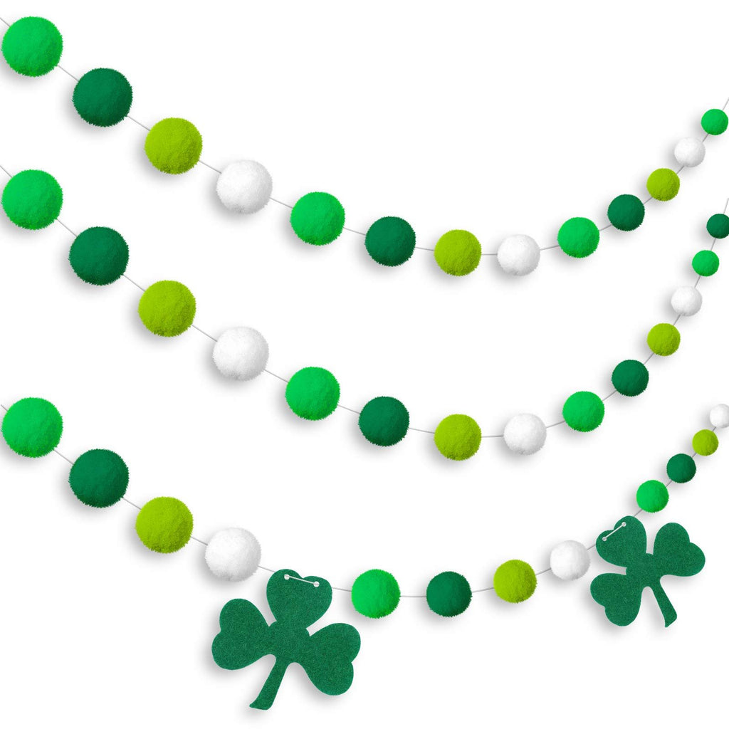 Three St. Patrick's Day garlands with green and white pom poms and felt shamrocks on white background