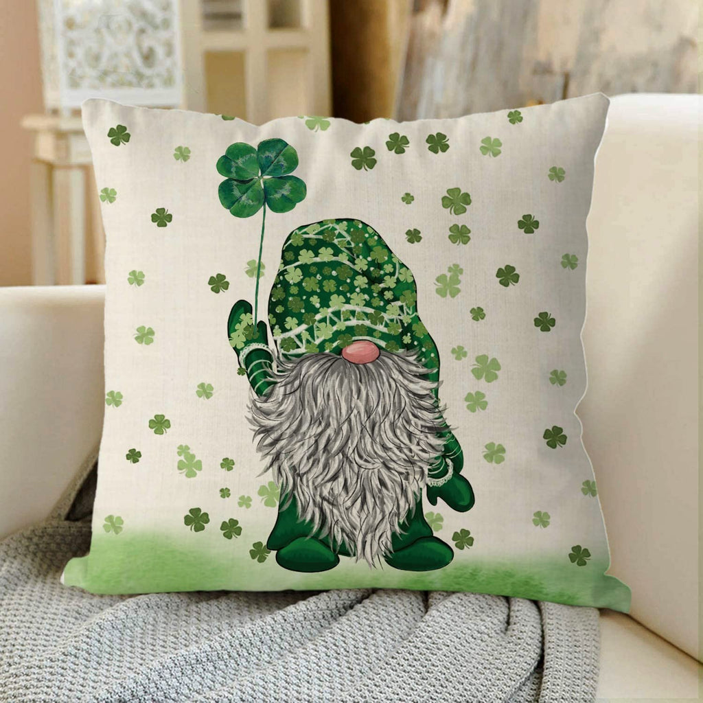 St. Patrick's Day pillow cover with a gnome holding a four-leaf clover, surrounded by shamrocks.