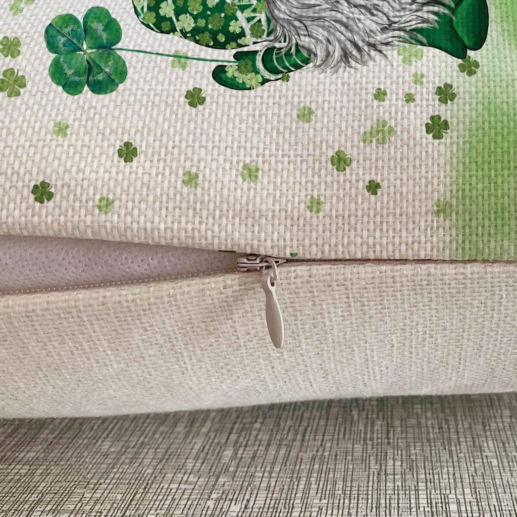 Close-up of a St. Patrick's Day pillow cover with a gnome holding a four-leaf clover and shamrocks.