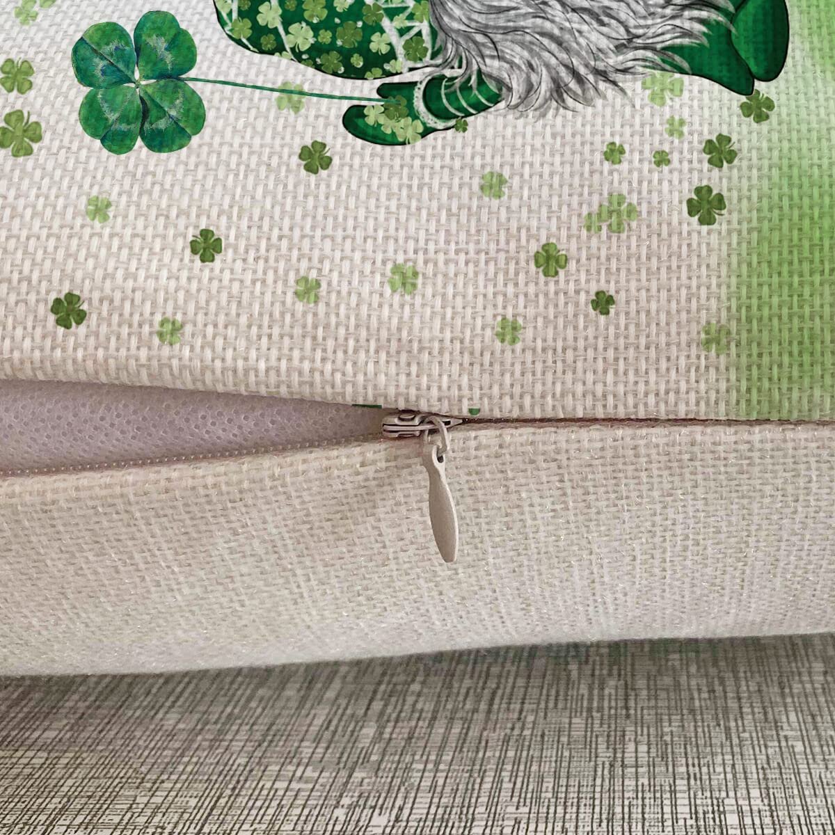 Close-up of a St. Patrick's Day pillow cover with a gnome holding a four-leaf clover and shamrocks.