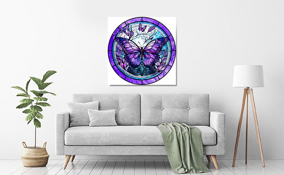 Stained glass butterfly diamond painting art hanging above a sofa in a living room setting.
