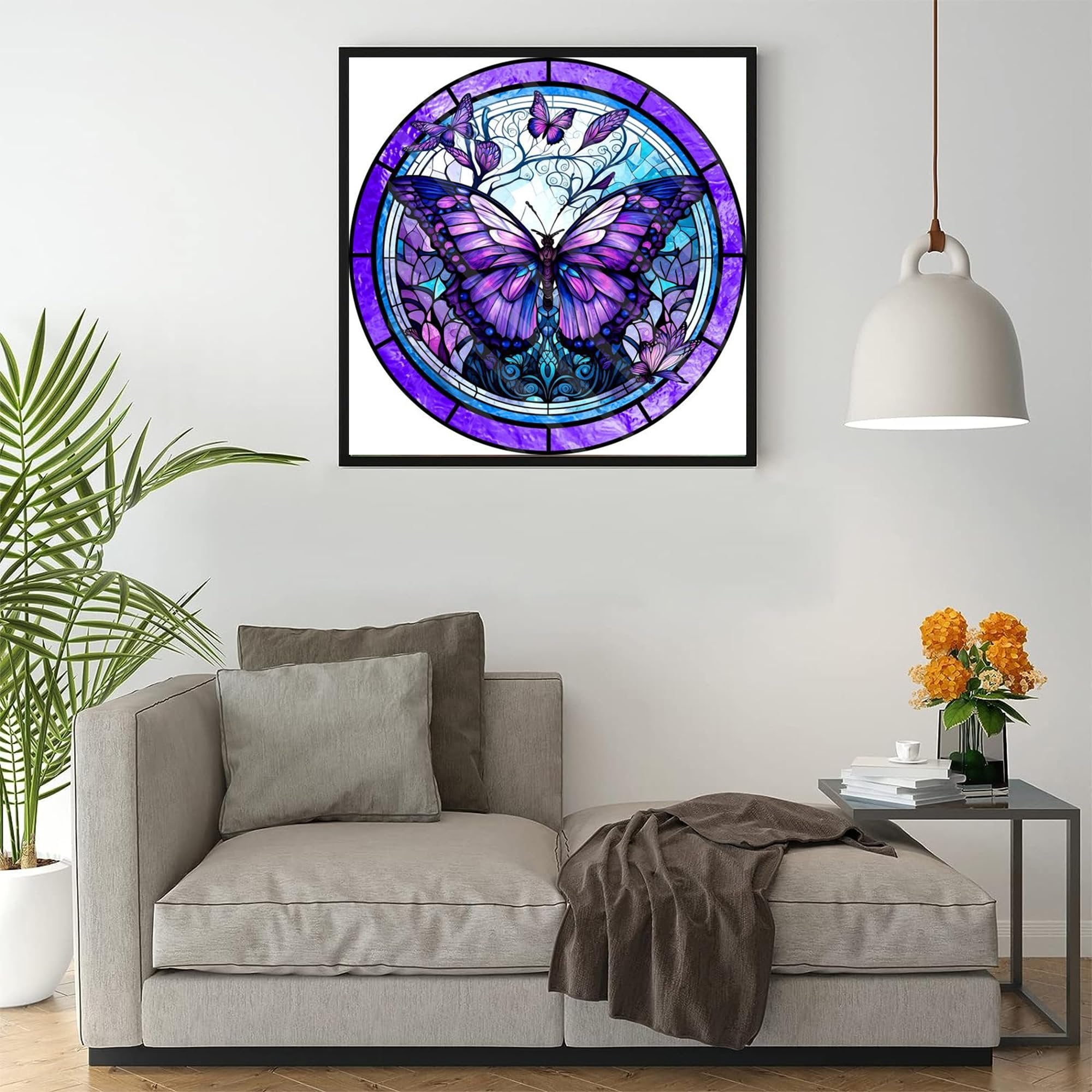 Stained glass butterfly diamond painting art framed and hanging on a wall above a sofa.