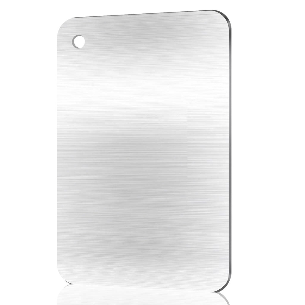 Brushed stainless steel cutting board with rounded corners and a hanging hole, shown at an angle on a white background with reflection.