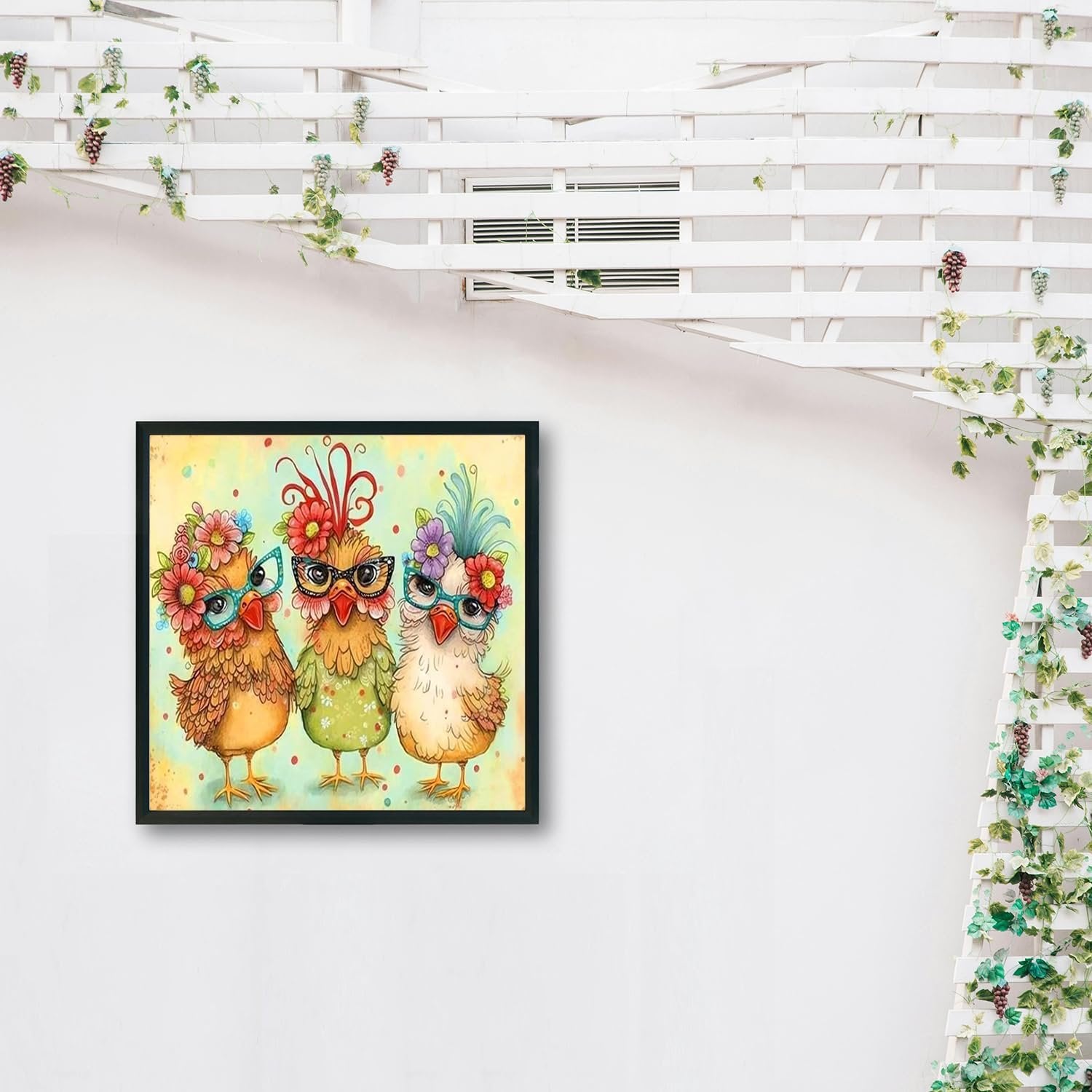 Framed artwork of three cartoon chickens wearing glasses and flowers, displayed on a white wall with a trellis and vines.
