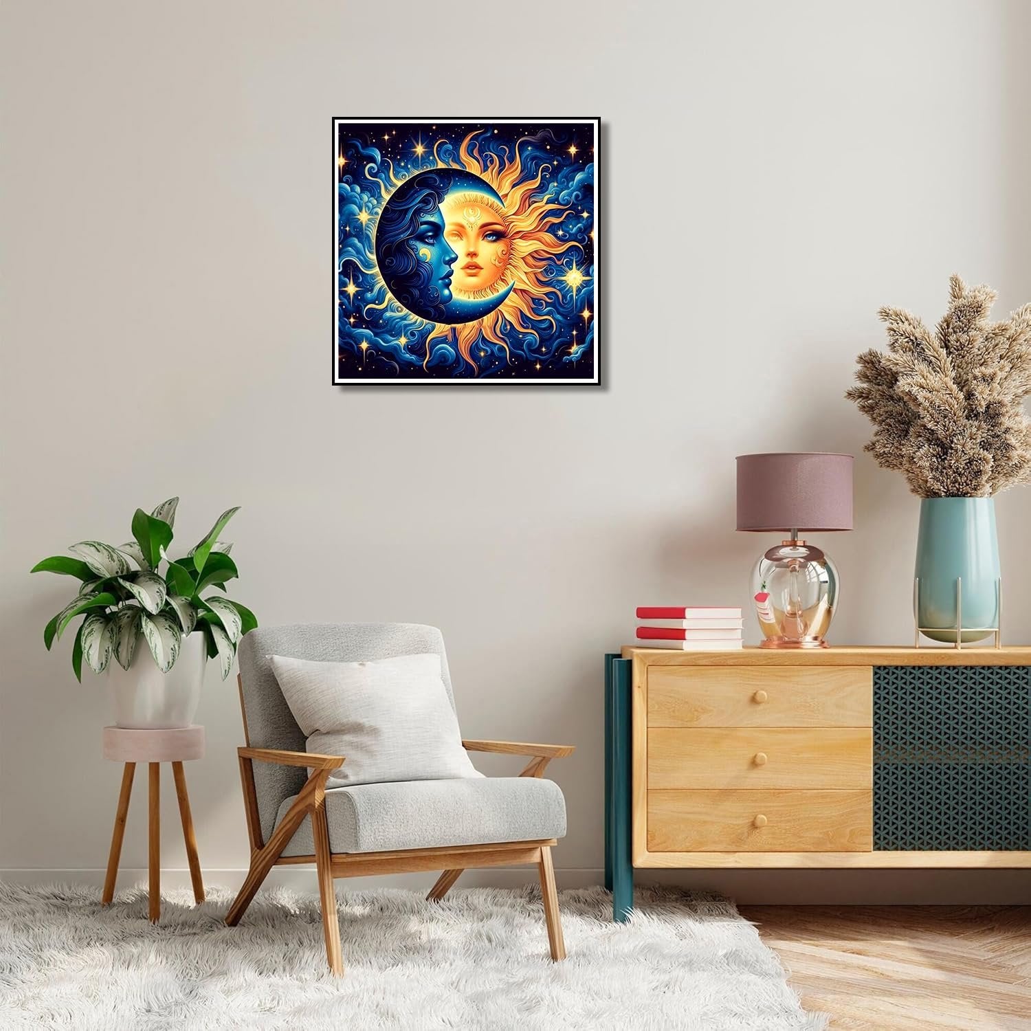 Framed paint by numbers artwork of a sun and moon face against a starry blue background, displayed in a living room setting.