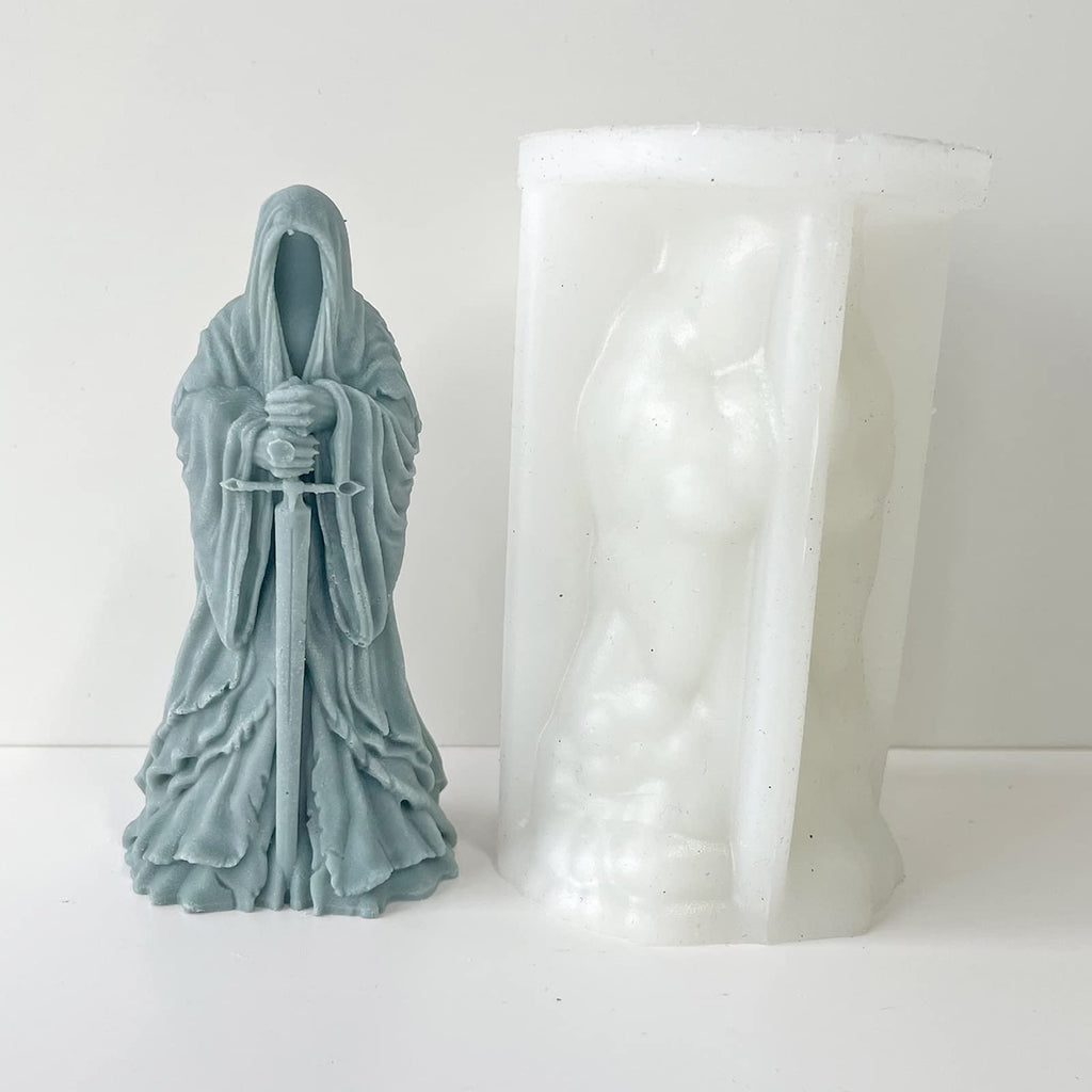 Silicone mold and a gray resin cast of a hooded figure holding a sword, displayed on a white background.