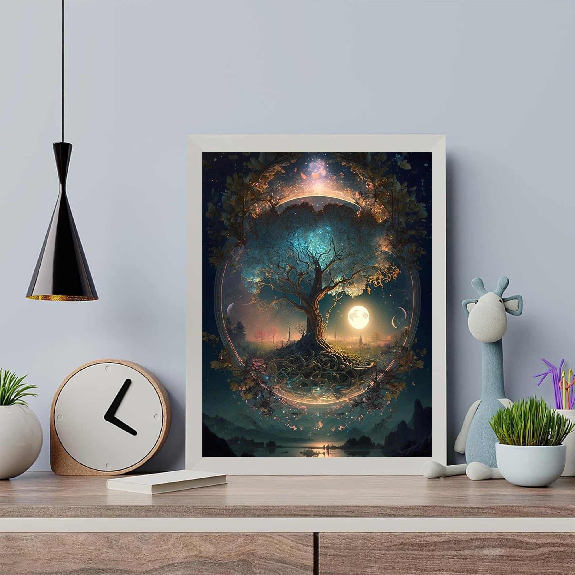 Framed Tree of Life painting with a full moon and starry sky, displayed on a shelf with decor.