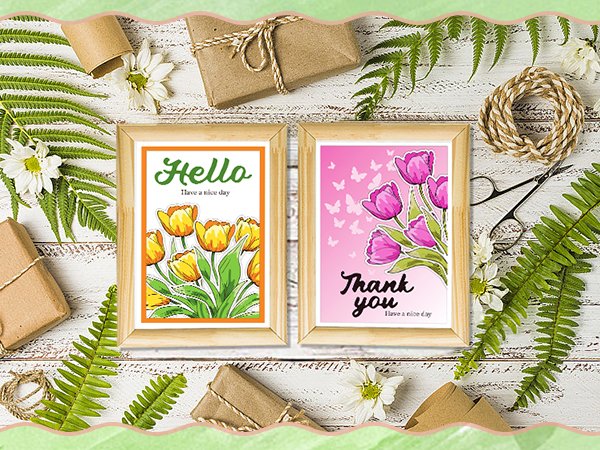 Two framed art prints with tulips and text, surrounded by craft supplies and greenery.