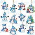 Twelve diamond art snowman keychain ornaments with blue winter hats and scarves, some holding gifts or trees.