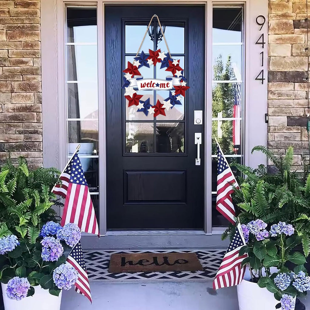 Patriotic door wreath with red, white, and blue stars and a 'welcome' banner hanging on a front door.