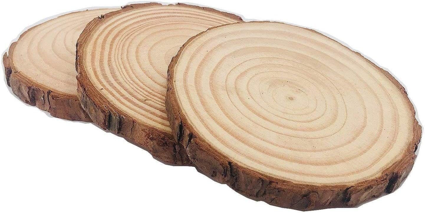 Three unfinished natural pine wood slices with bark, showing wood grain and rough edges, on a white background.
