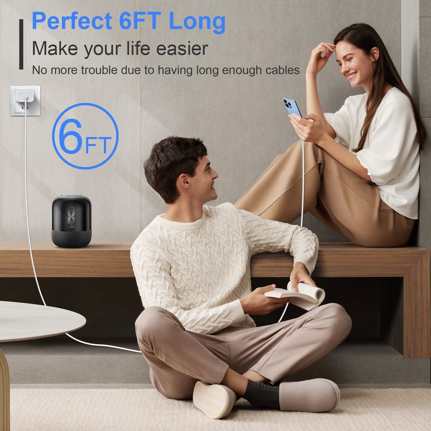 Couple using a white USB-C to Lightning cable to charge devices in a living room setting.